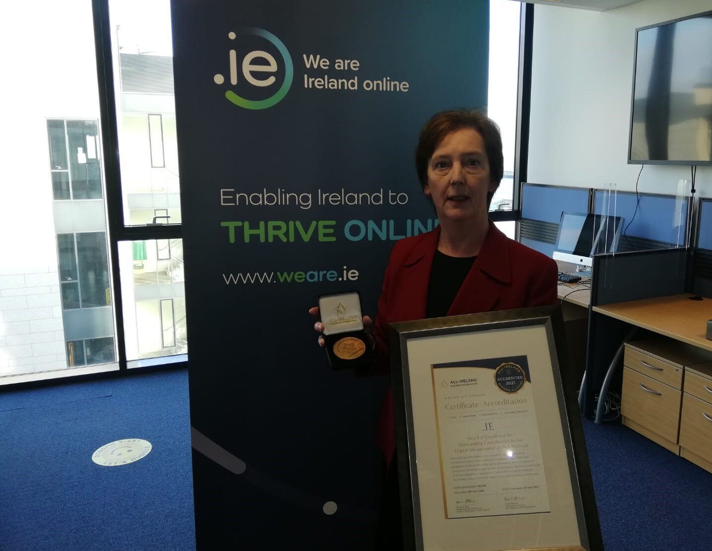 Oonagh accepting award.IE wins award of excellence
