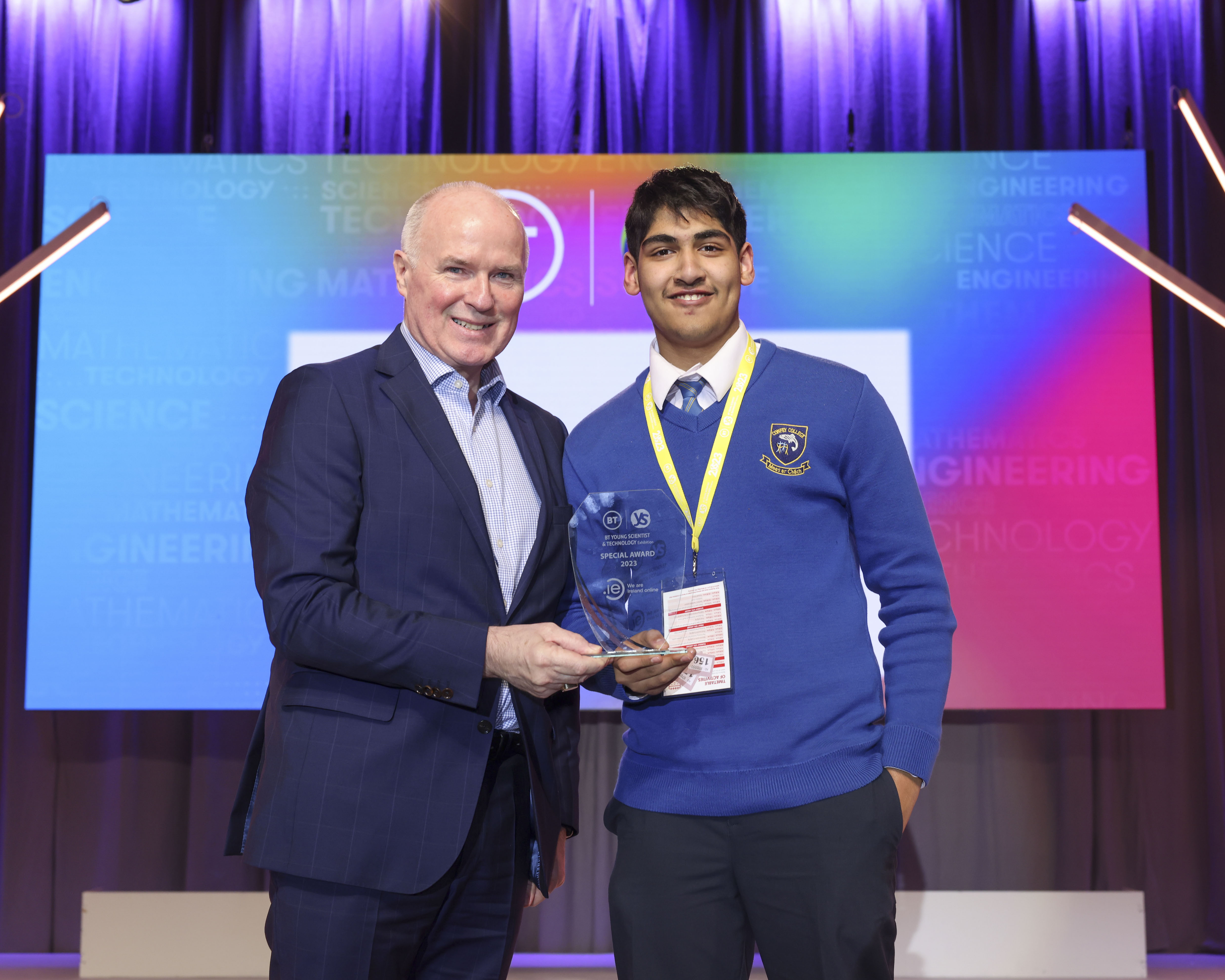The BT Young Scientist & Technology Exhibition 2023, CEO David Curtin presenting Shaunak Mohapatra from Confey Community College the .IE Special Award.